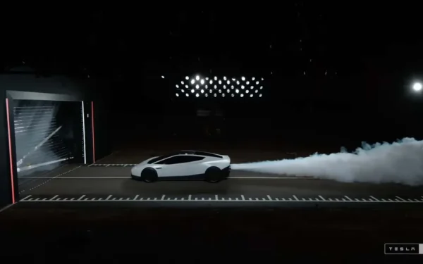 Elon Musk Unveils Flying Car, Demonstrates Tesla Roadster Driving Upside Down on Curved Ramp, Leaping into the Air, Performing a Flip and Landing on Its Wheels (Image 1)